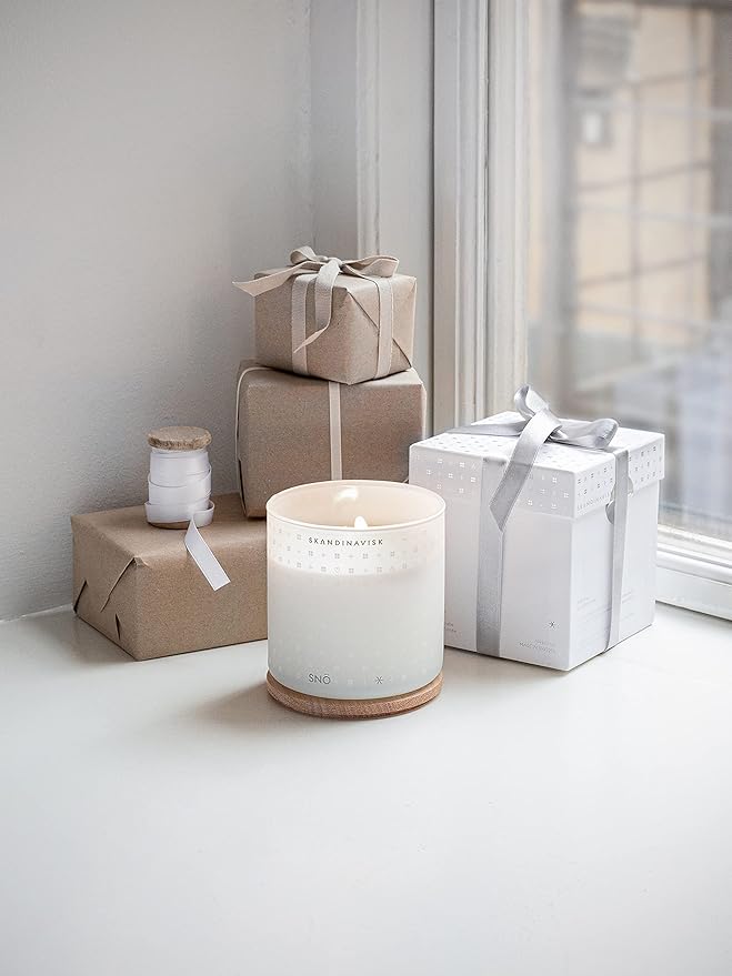 Skandinavisk SNÖ 'Snow' Scented Candle with 2 Wicks. Fragrance Notes: Frozen Forests and Frosted Berries, The Sharp Breath of Subzero Skies. 14.1 oz.